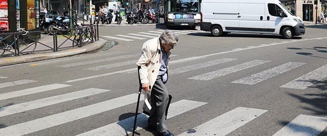 The old woman tries to cross the road, but they don’t want to give way to her.