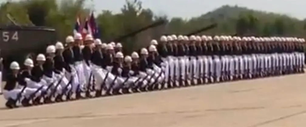 Soldiers With Rifles Stand In A Straight Line, Pay Close Attention To Their Legs