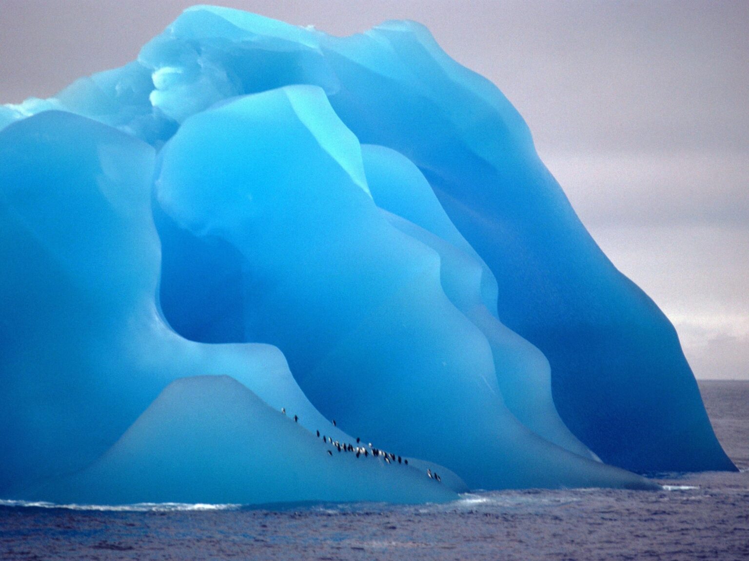 Destructive Beauty: Icebergs Flip with the Power of an Atomic Bomb