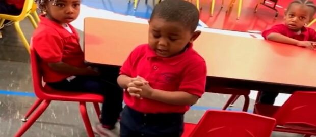 The little boy prays every day before eating