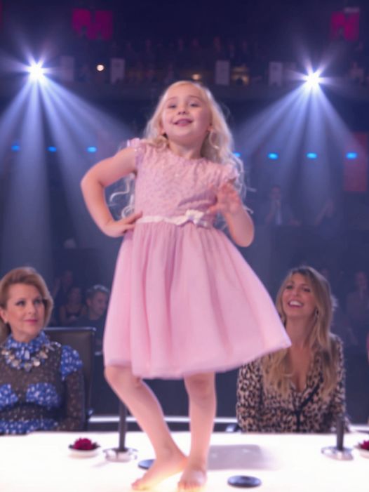 The little girl and the boy got on the stage and presented a very beautiful dance