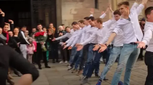 She Thinks It’s Just a Dance Group in the Plaza – Until She Sees the Flowers