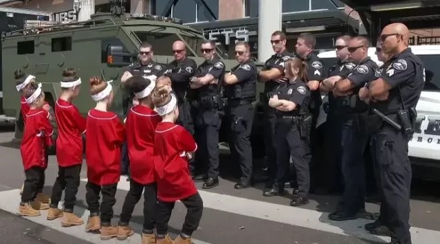 Tiny Dancers and Local Cops Line Up on the Street for an Epic Dance Battle