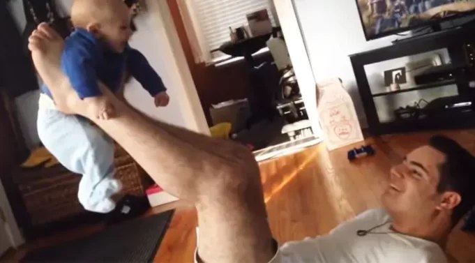 Dad Playing With Newborn Son Seems Normal Until the Camera Zooms Out